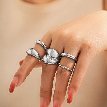 Design sense: simple hugging, smooth curved ring, layered style, niche geometric rings