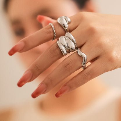 Design sense: simple hugging, smooth curved ring, layered style, niche geometric rings